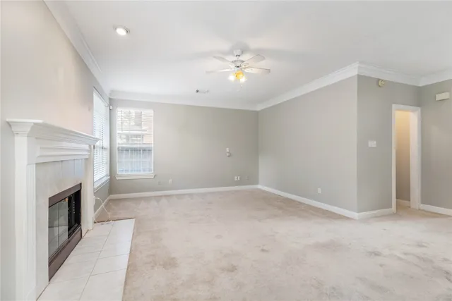 a view of an empty room with a fireplace