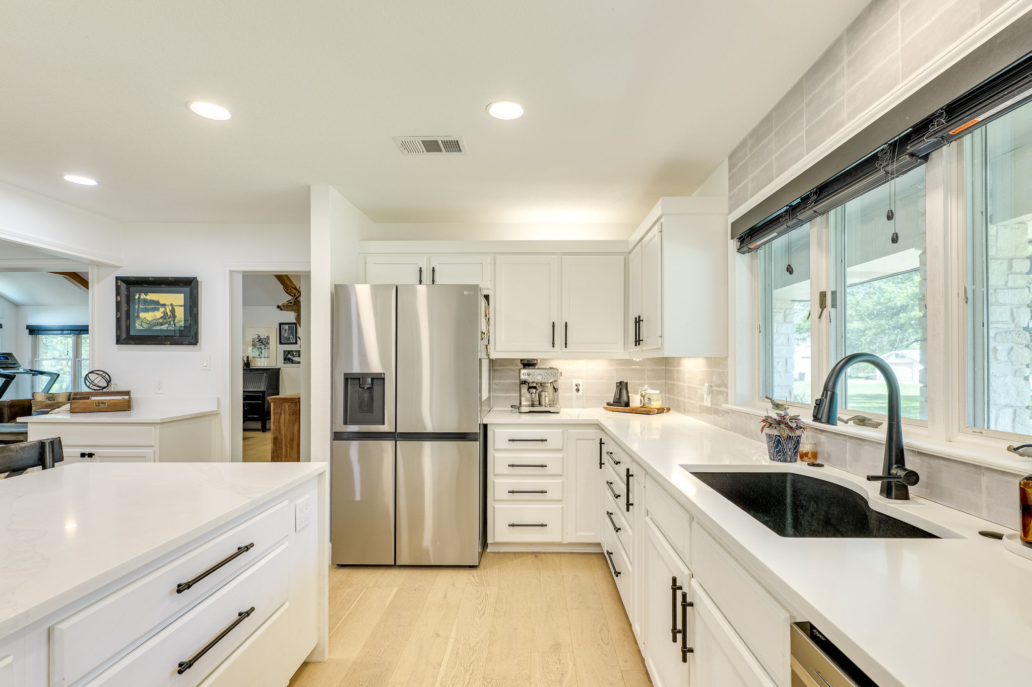 320 Greenridge Road Georgetown, TX 78628 - Photo 12 of 38 a kitchen with white cabinets and stainless steel appliances