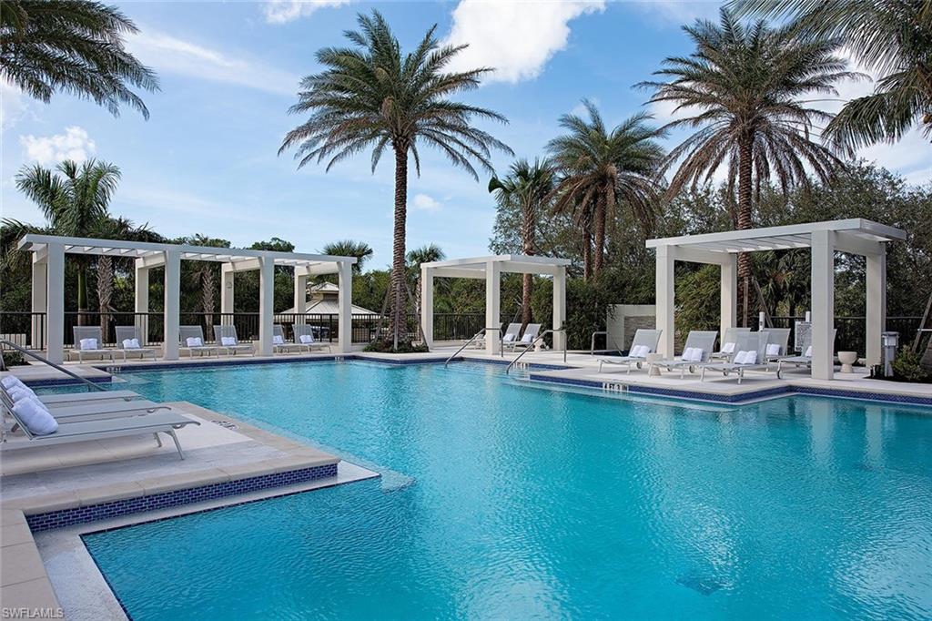 6897 Grenadier Boulevard, Unit 1701 Naples, FL 34108 - Photo 14 of 14 a view of house with swimming pool and outdoor seating