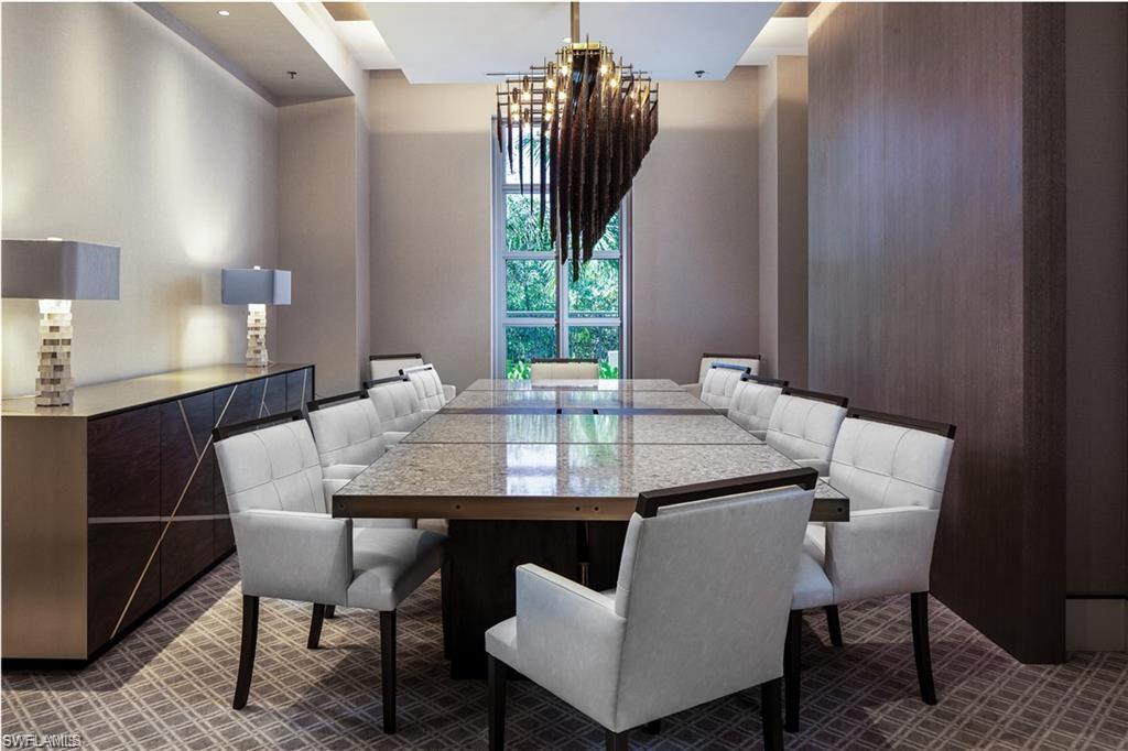 6897 Grenadier Boulevard, Unit 1701 Naples, FL 34108 - Photo 10 of 14 a view of a dining room with furniture and window