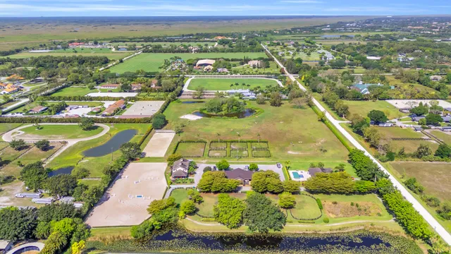 an aerial view of residential building and ocean view