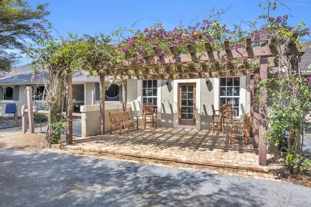 a view of yard with swimming pool and sitting area