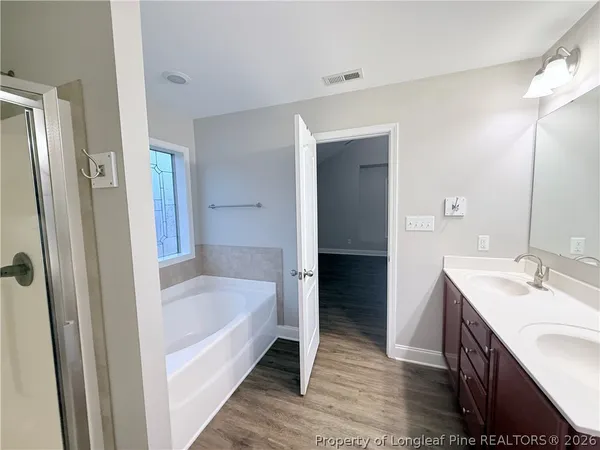 a bathroom with a bathtub and a sink