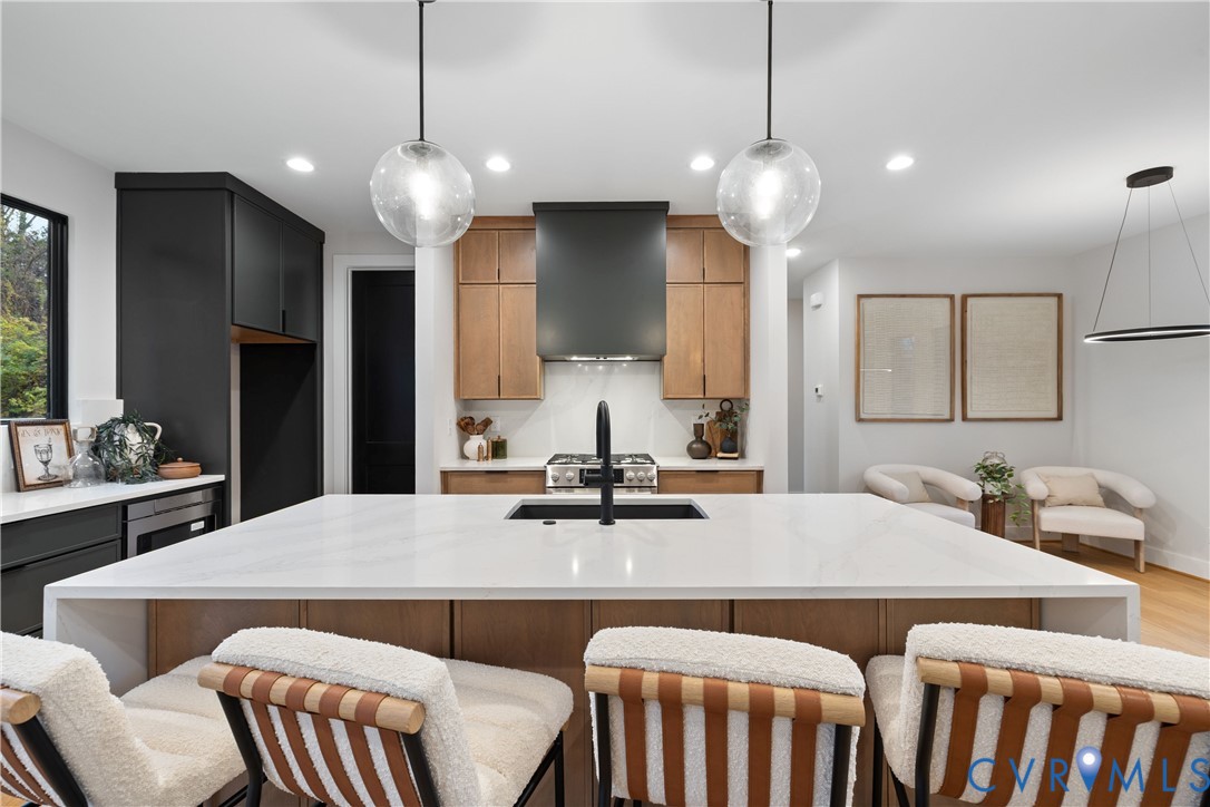 8632 Cherokee Road Richmond, VA 23235 - Photo 13 of 34 a kitchen that has a table chairs and a table