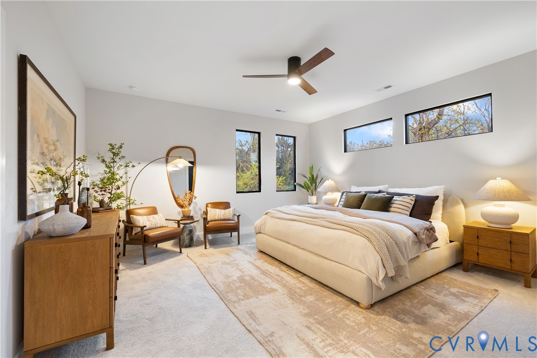 8632 Cherokee Road Richmond, VA 23235 - Photo 18 of 34 a bed room with a bed and a couch