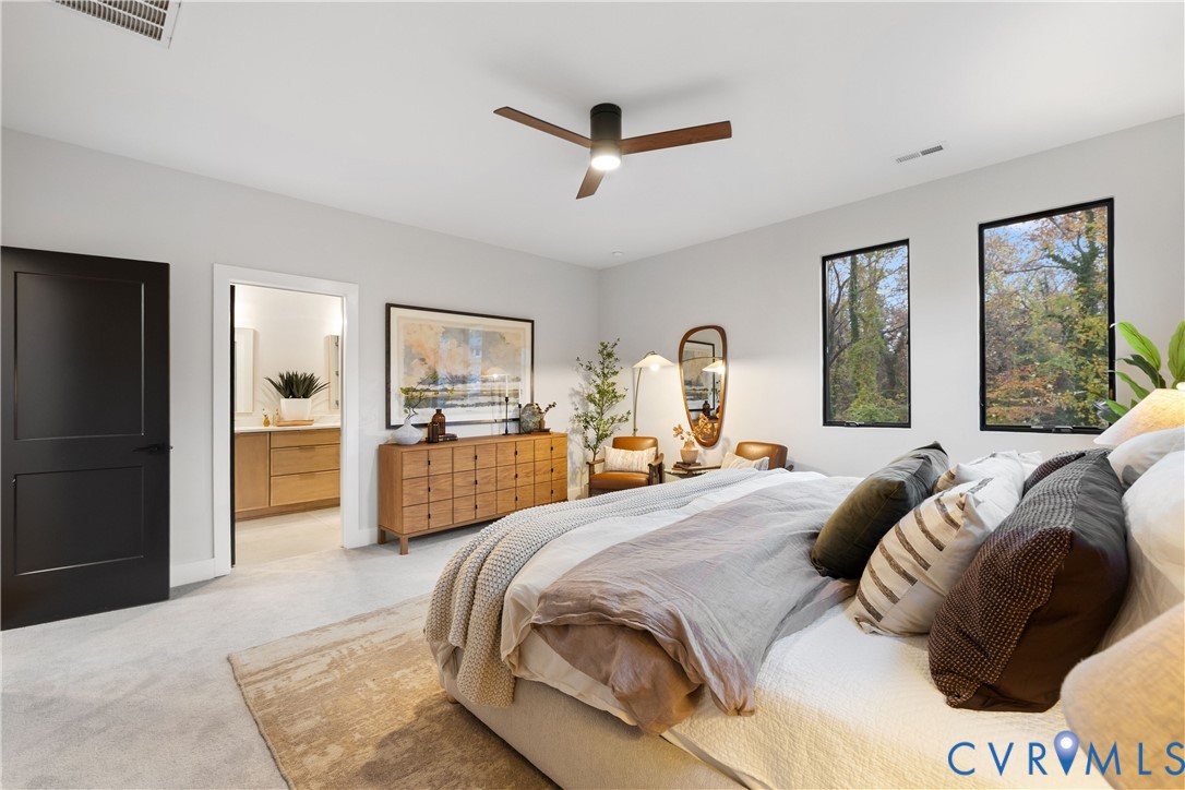 8632 Cherokee Road Richmond, VA 23235 - Photo 22 of 34 a bedroom with a large bed and a view of kitchen