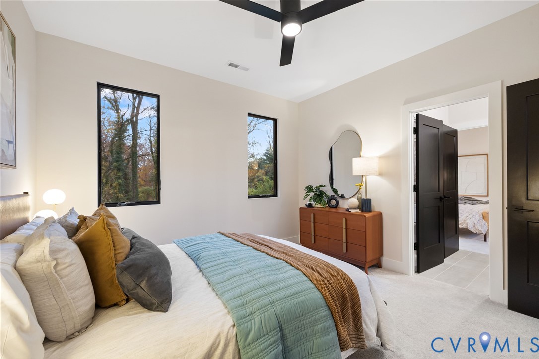 8632 Cherokee Road Richmond, VA 23235 - Photo 27 of 34 a bedroom with a bed and a dresser