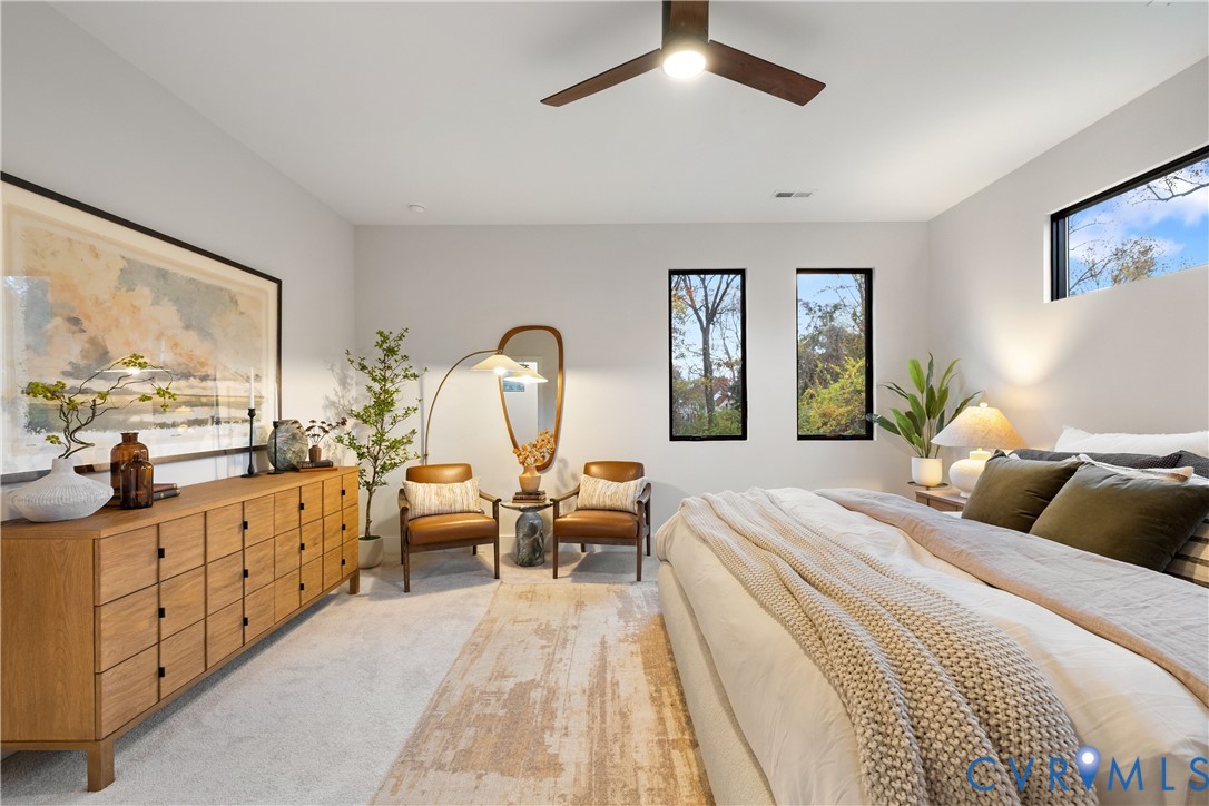 8632 Cherokee Road Richmond, VA 23235 - Photo 32 of 34 a bedroom with a large bed and a large window