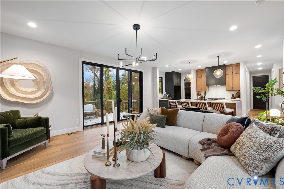8632 Cherokee Road Richmond, VA 23235 - Photo 4 of 34 a living room with furniture potted plant and a large window