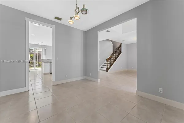 a kitchen with stainless steel appliances granite countertop a stove and a sink