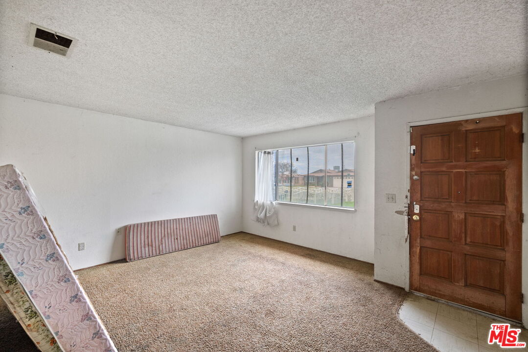 1112 Valencia Avenue Delano, CA 93215 - Photo 11 of 55 a view of an empty room with a window