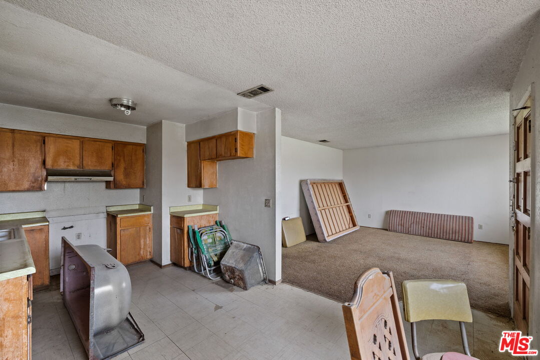 1112 Valencia Avenue Delano, CA 93215 - Photo 18 of 55 a bedroom with furniture and a fireplace