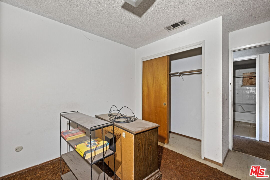 1112 Valencia Avenue Delano, CA 93215 - Photo 25 of 55 a room that has a table and a chair