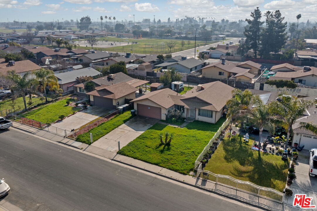 1112 Valencia Avenue Delano, CA 93215 - Photo 3 of 55 an aerial view of residential houses with outdoor space and ocean view