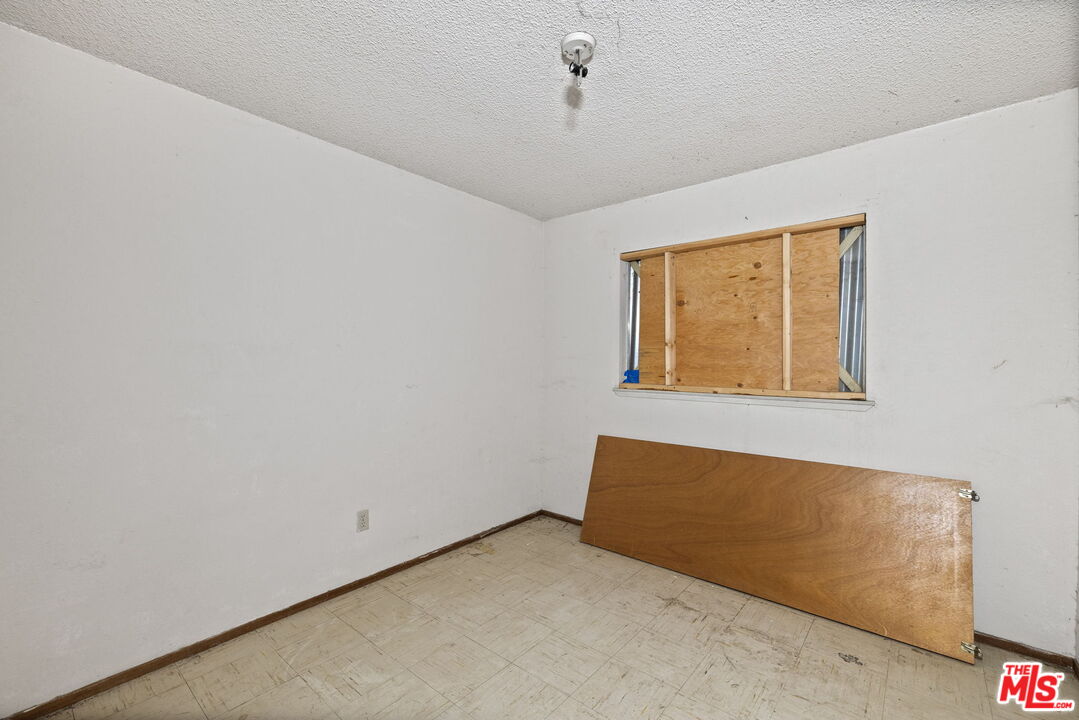 1112 Valencia Avenue Delano, CA 93215 - Photo 34 of 55 a view of an empty room with a window