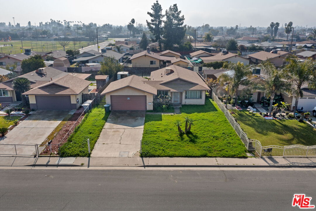 1112 Valencia Avenue Delano, CA 93215 - Photo 44 of 55 an aerial view of multiple houses with a yard