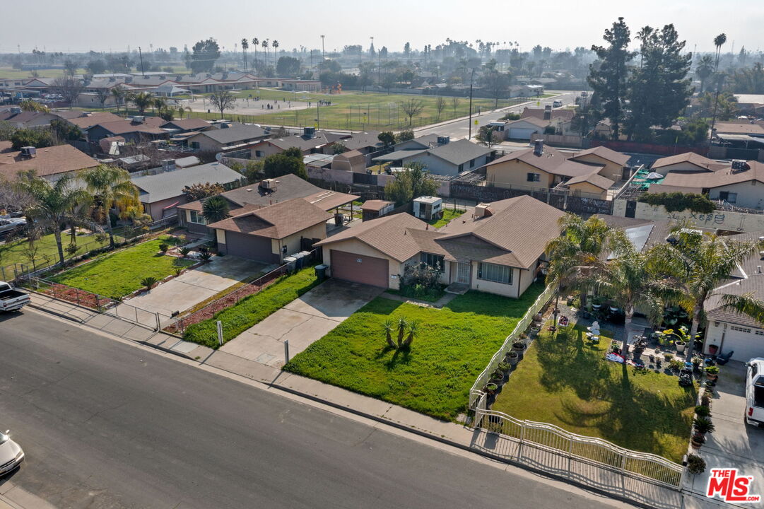 1112 Valencia Avenue Delano, CA 93215 - Photo 45 of 55 an aerial view of residential houses with outdoor space and ocean view
