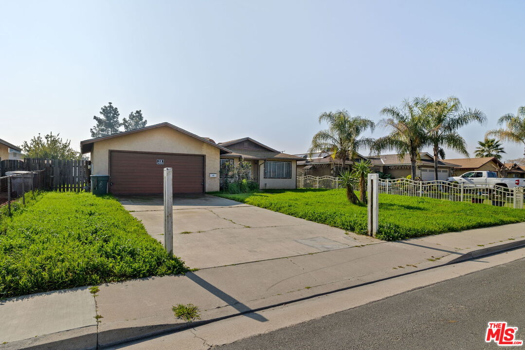 1112 Valencia Avenue Delano, CA 93215 - Photo 48 of 55 a house with yard in front of it