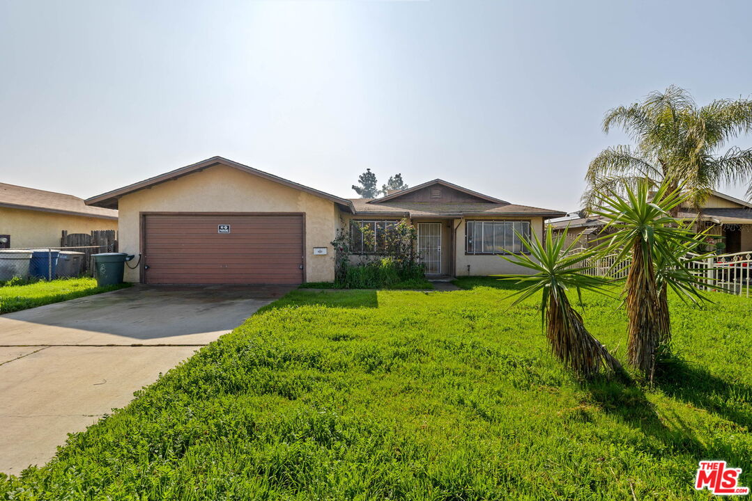 1112 Valencia Avenue Delano, CA 93215 - Photo 51 of 55 a front view of a house with a garden