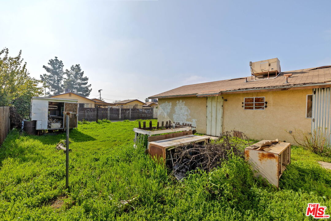 1112 Valencia Avenue Delano, CA 93215 - Photo 53 of 55 a front view of a house with garden