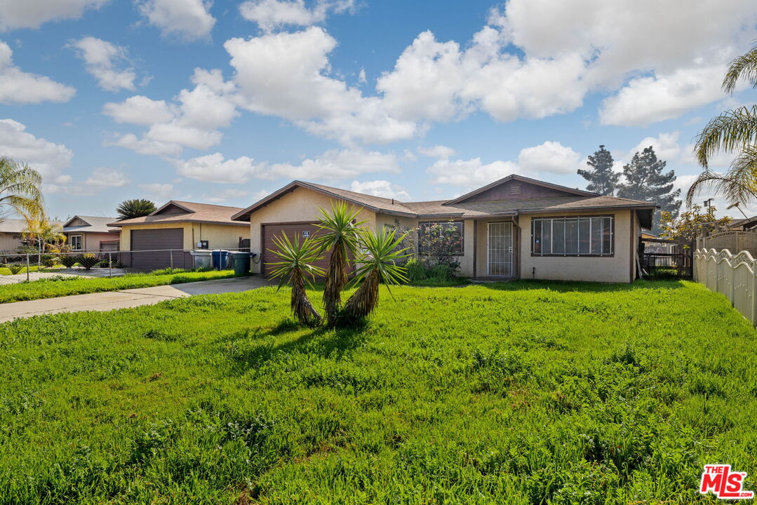 1112 Valencia Avenue Delano, CA 93215 - Photo 6 of 55 a view of a house with a big yard plants and large trees