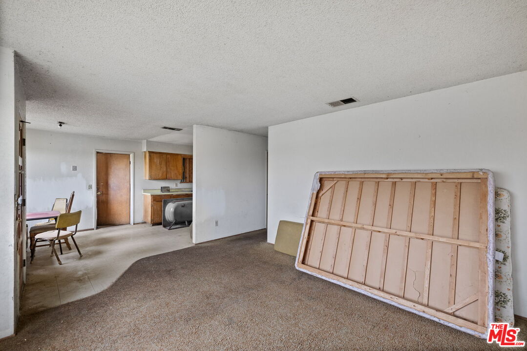 1112 Valencia Avenue Delano, CA 93215 - Photo 9 of 55 a view of a livingroom with furniture and staircase
