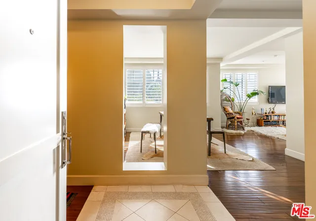 a view of a living room with a wooden floor