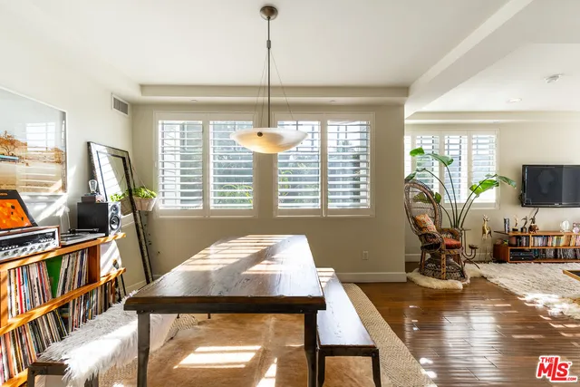 a living room with fireplace furniture and a flat screen tv
