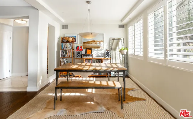 a view of a room with furniture and a window