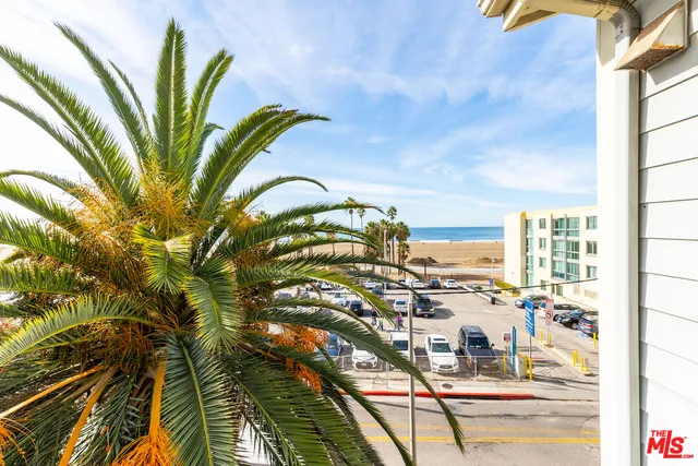 a view of a swimming pool with outdoor seating