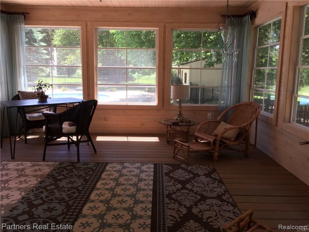 4400 Golf Club Road Howell, MI 48843 - Photo 55 of 68 Seasonal Sunroom overlooking pool and patio