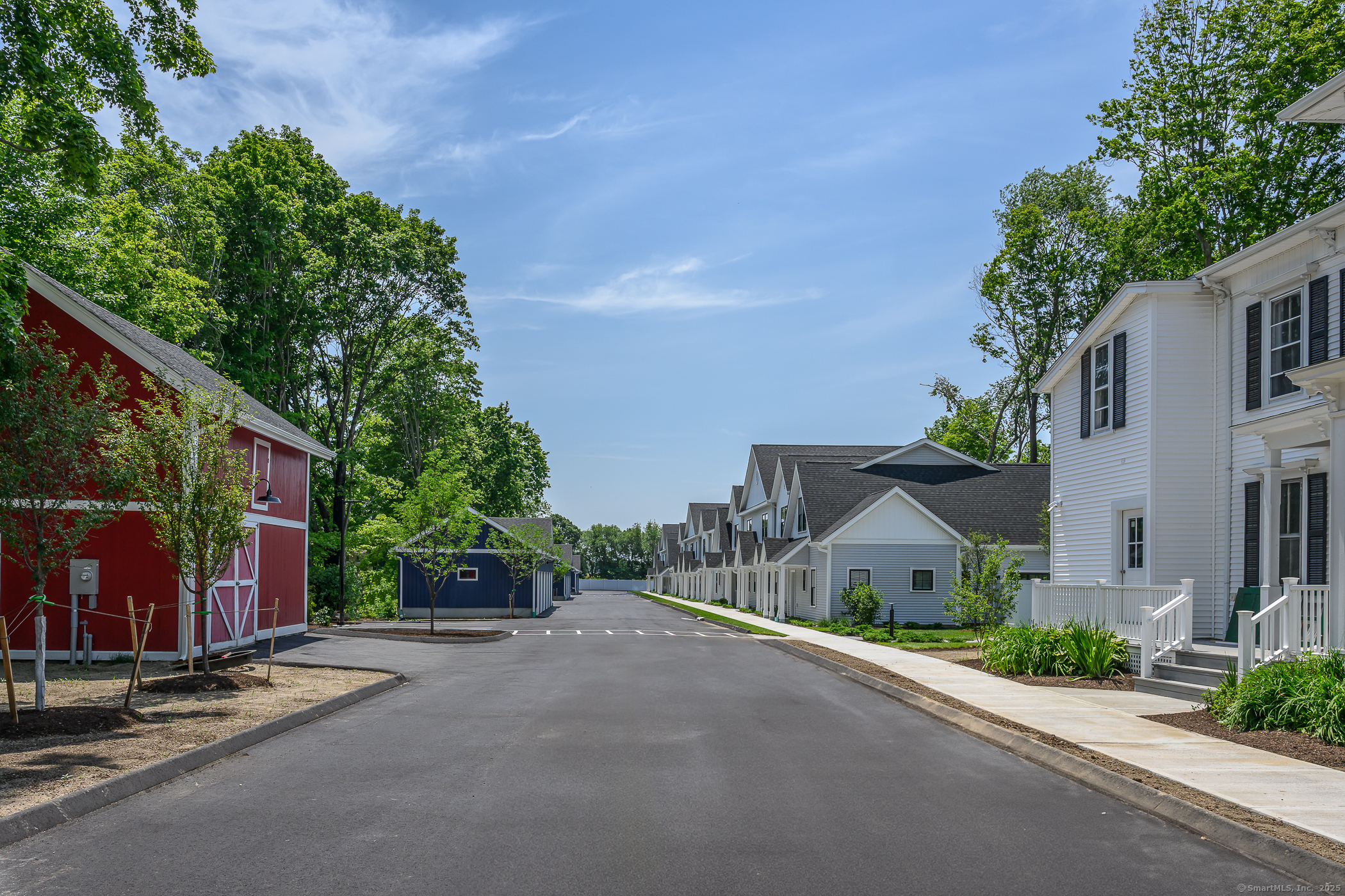 138 Boston Post Road, Unit 10 East Lyme, CT 06333 - Photo 13 of 18 a view of a street with houses on both side of it