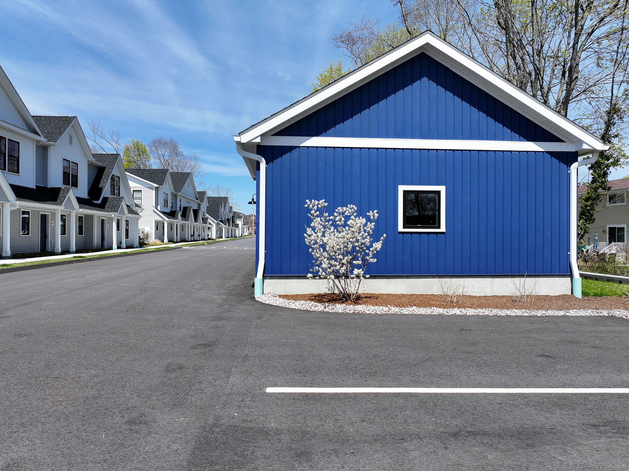 138 Boston Post Road, Unit 10 East Lyme, CT 06333 - Photo 15 of 18 a view of a house with a yard