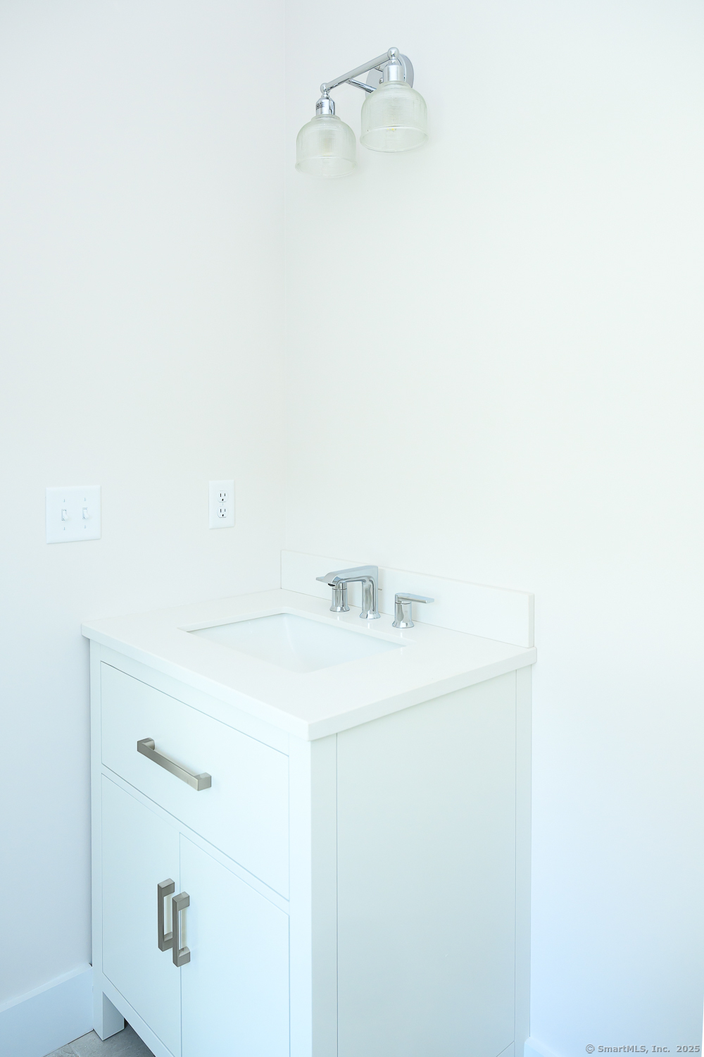 138 Boston Post Road, Unit 10 East Lyme, CT 06333 - Photo 4 of 18 a bathroom with a sink and a mirror