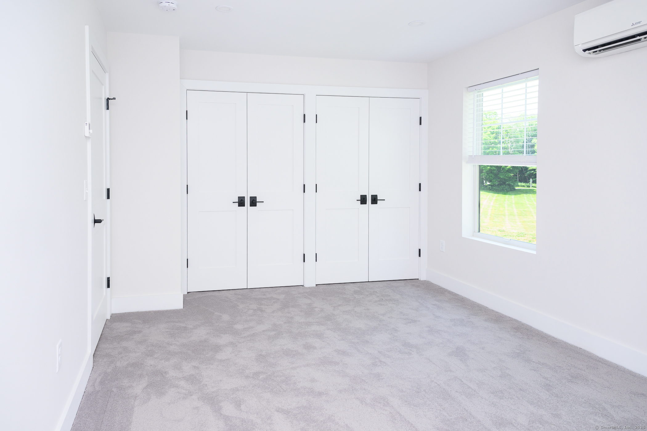 138 Boston Post Road, Unit 10 East Lyme, CT 06333 - Photo 5 of 18 a view of an empty room with a window