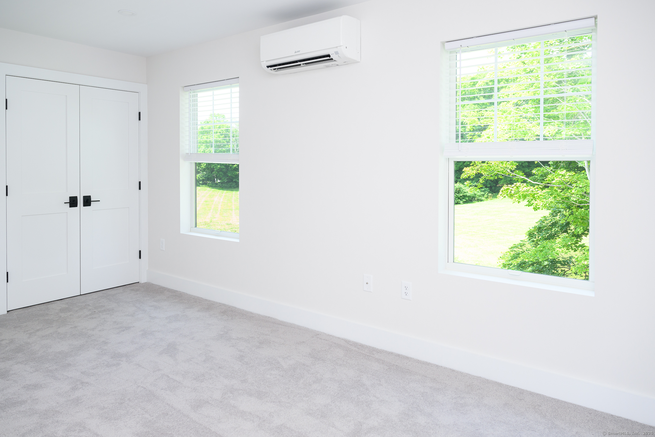 138 Boston Post Road, Unit 10 East Lyme, CT 06333 - Photo 6 of 18 a view of an empty room with a window