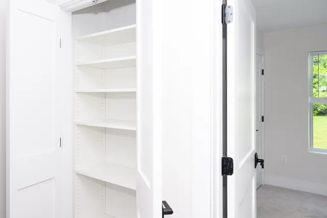 a close view of closet with wooden floor
