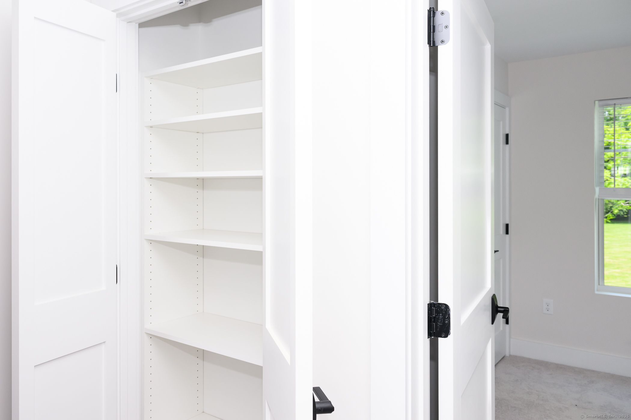 138 Boston Post Road, Unit 10 East Lyme, CT 06333 - Photo 8 of 18 a close view of closet with wooden floor