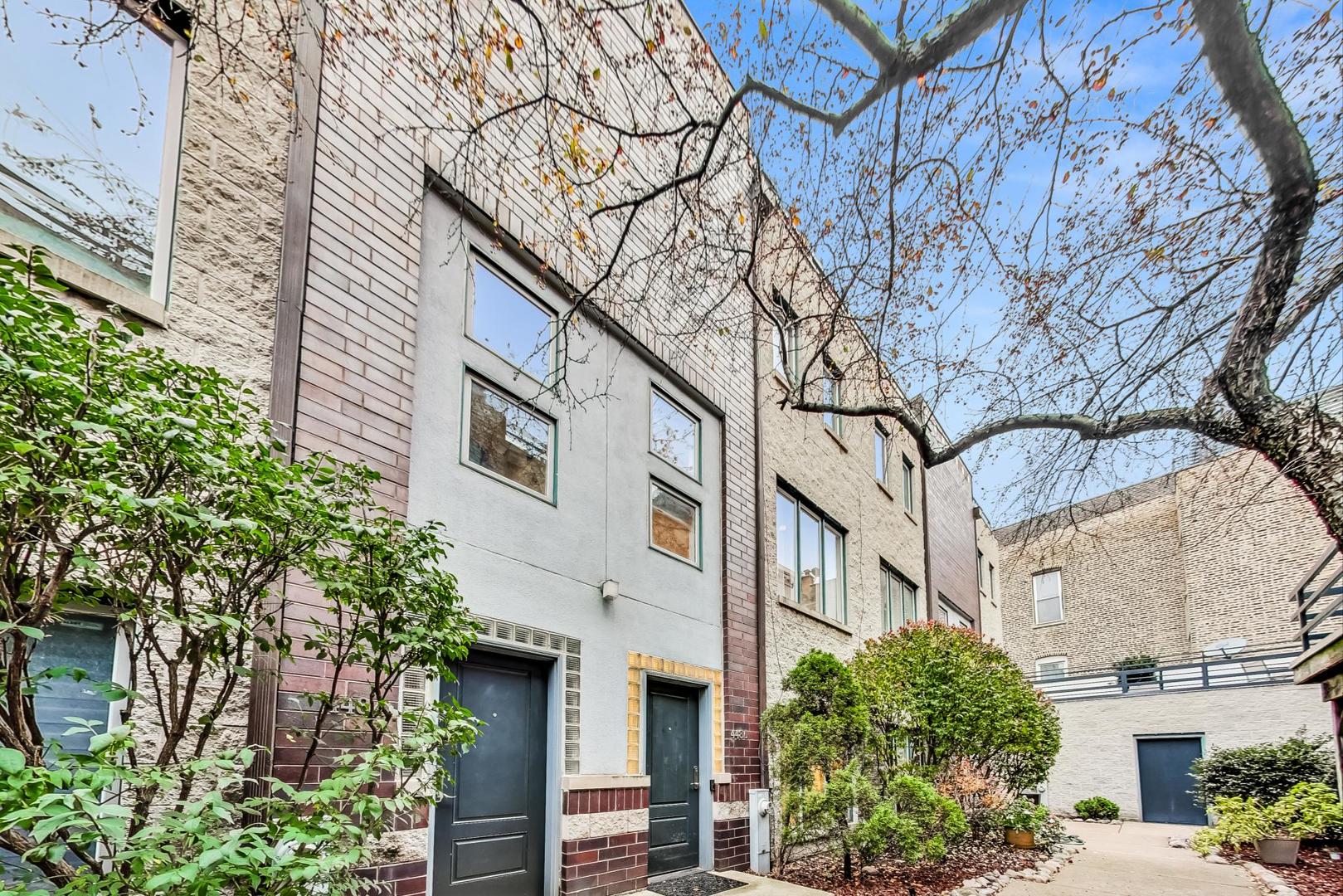448 North Carpenter Street, Unit J Chicago, IL 60642 - Photo 1 of 39 a view of a building with a tree