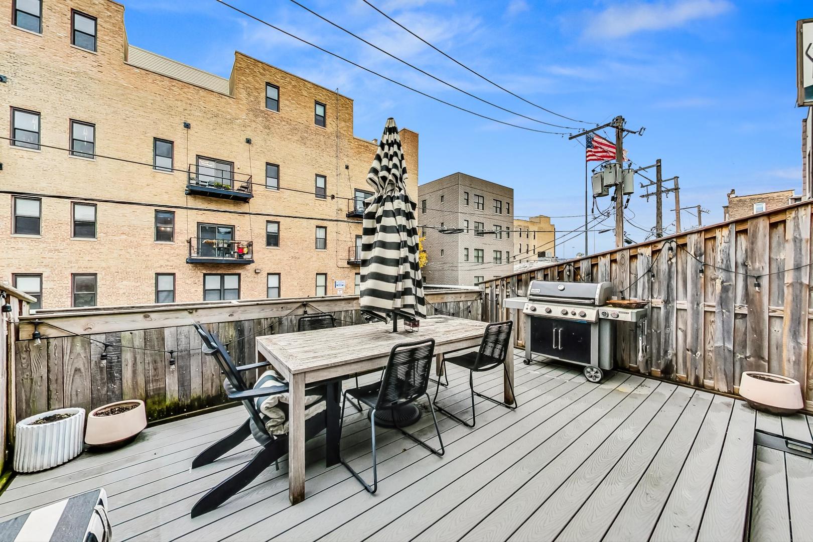 448 North Carpenter Street, Unit J Chicago, IL 60642 - Photo 14 of 39 a view of balcony deck and outdoor seating