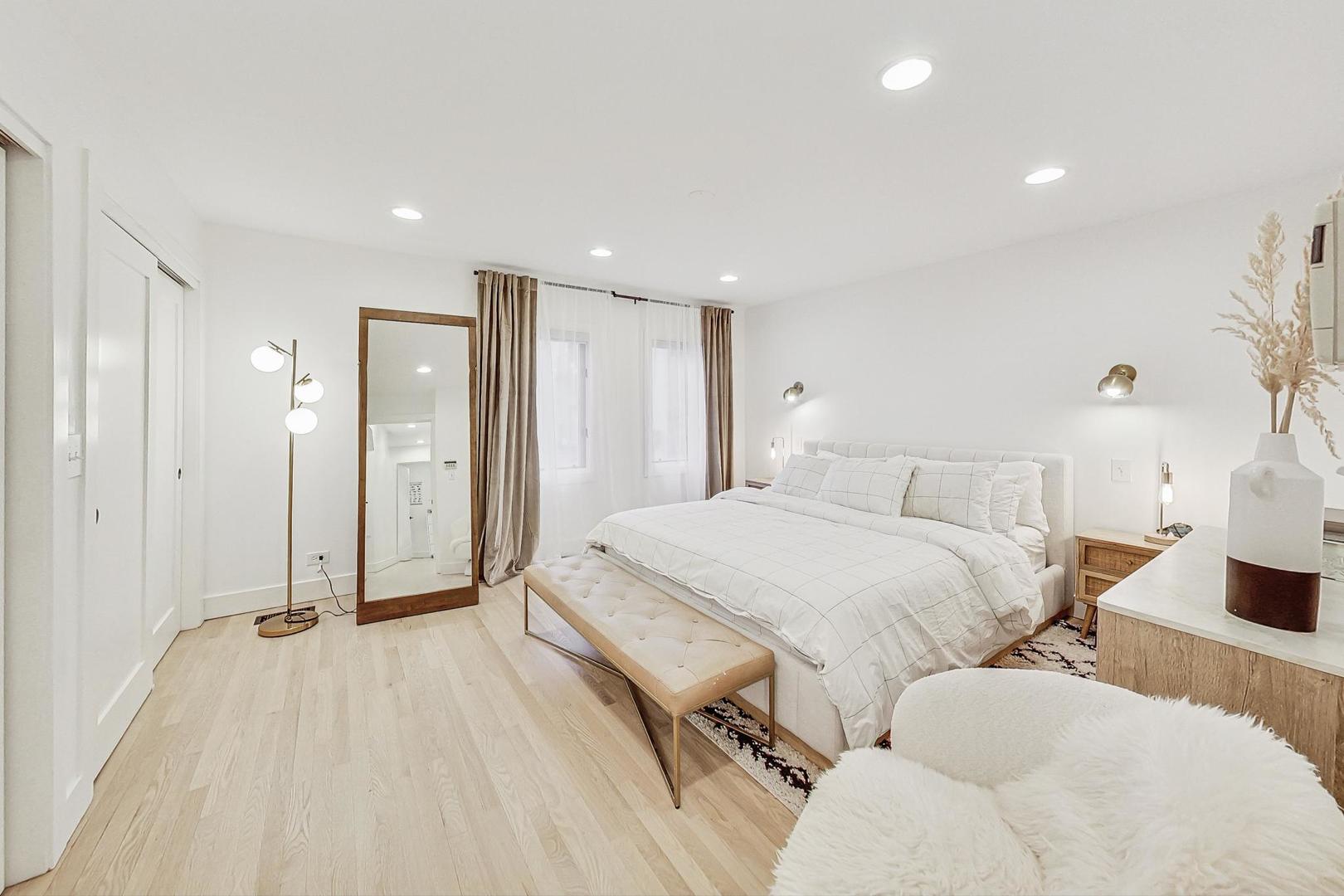 448 North Carpenter Street, Unit J Chicago, IL 60642 - Photo 15 of 39 a spacious bedroom with two beds and a shower