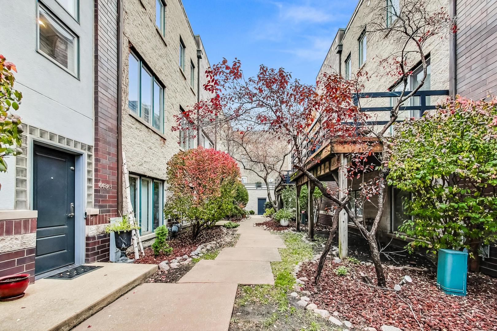 448 North Carpenter Street, Unit J Chicago, IL 60642 - Photo 2 of 39 a view of a pathway with a house