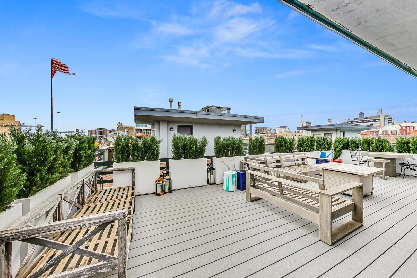 448 North Carpenter Street, Unit J Chicago, IL 60642 - Photo 22 of 39 a view of roof deck with seating space