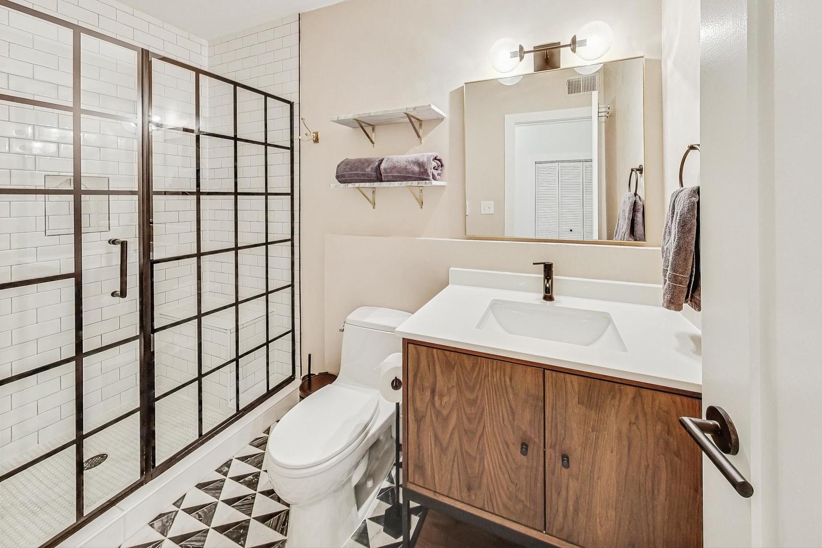 448 North Carpenter Street, Unit J Chicago, IL 60642 - Photo 31 of 39 a bathroom with a sink toilet and shower