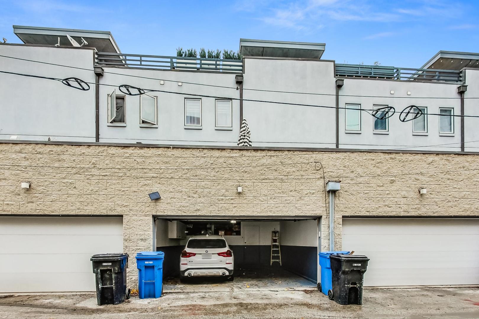 448 North Carpenter Street, Unit J Chicago, IL 60642 - Photo 33 of 39 a view of a car park in front of house