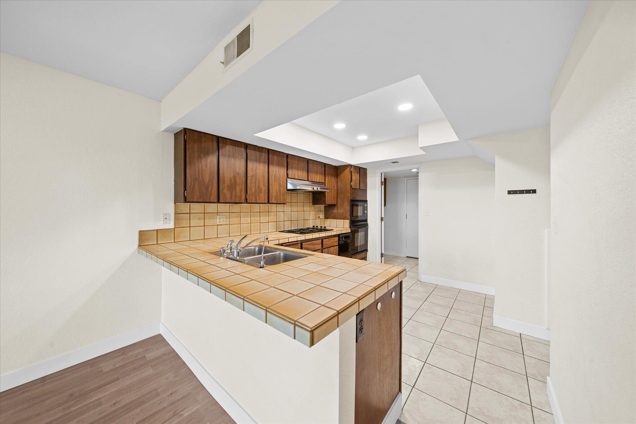 1954 Bechelli Lane Redding, CA 96002 - Photo 14 of 44 a kitchen with a stove and a refrigerator