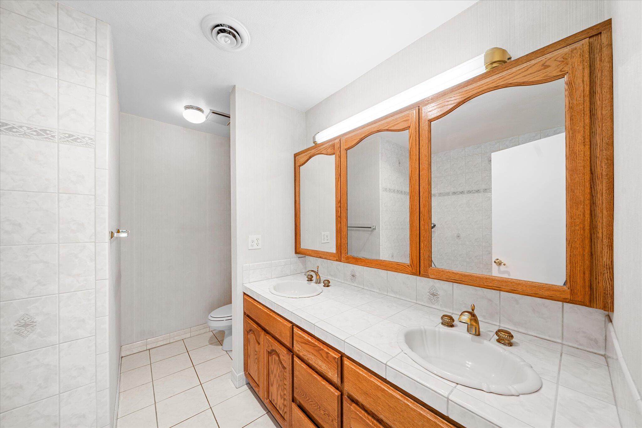 1954 Bechelli Lane Redding, CA 96002 - Photo 22 of 44 a bathroom with a double vanity sink mirror and double