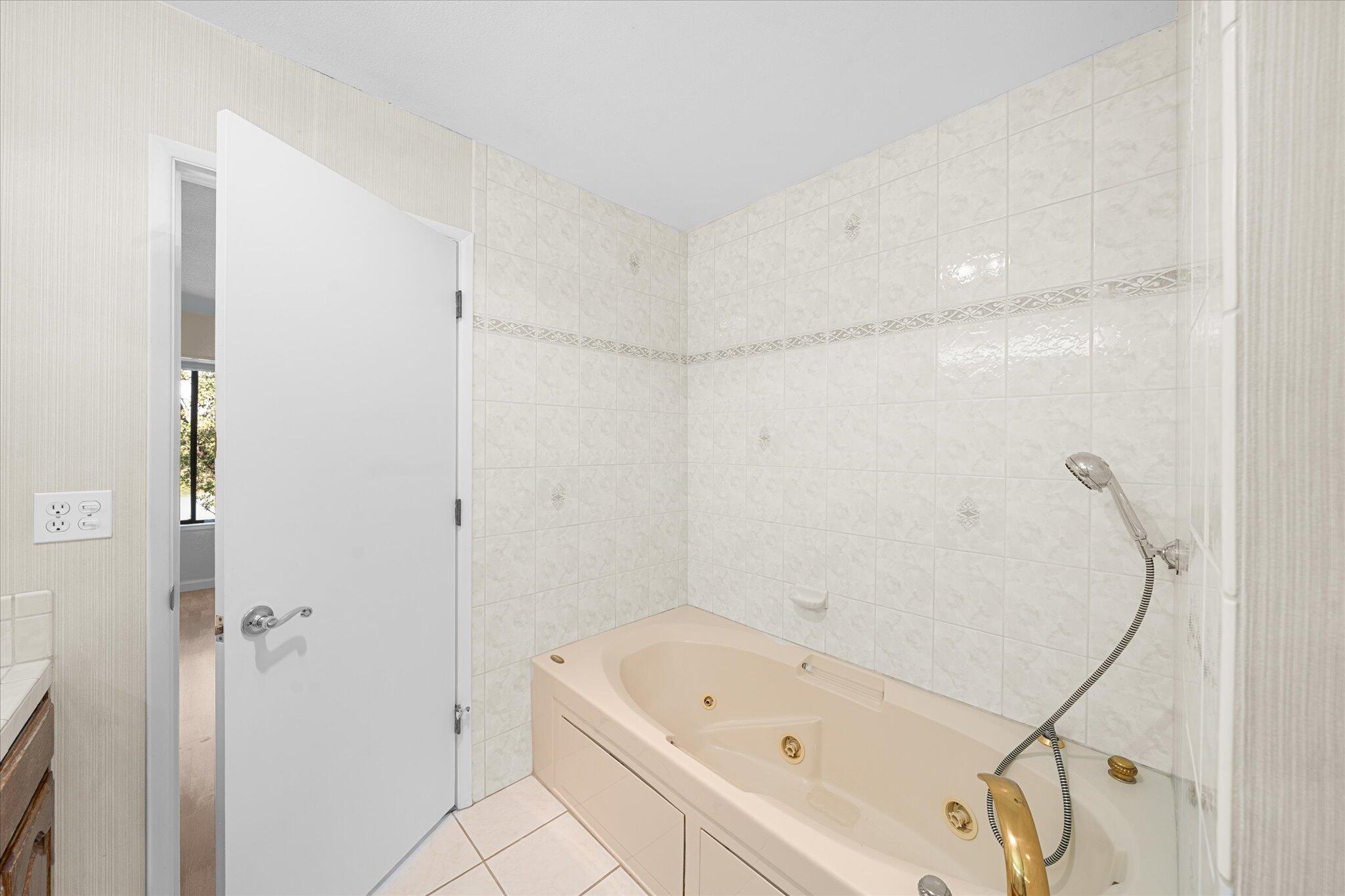 1954 Bechelli Lane Redding, CA 96002 - Photo 23 of 44 a bathroom with a tub and shower