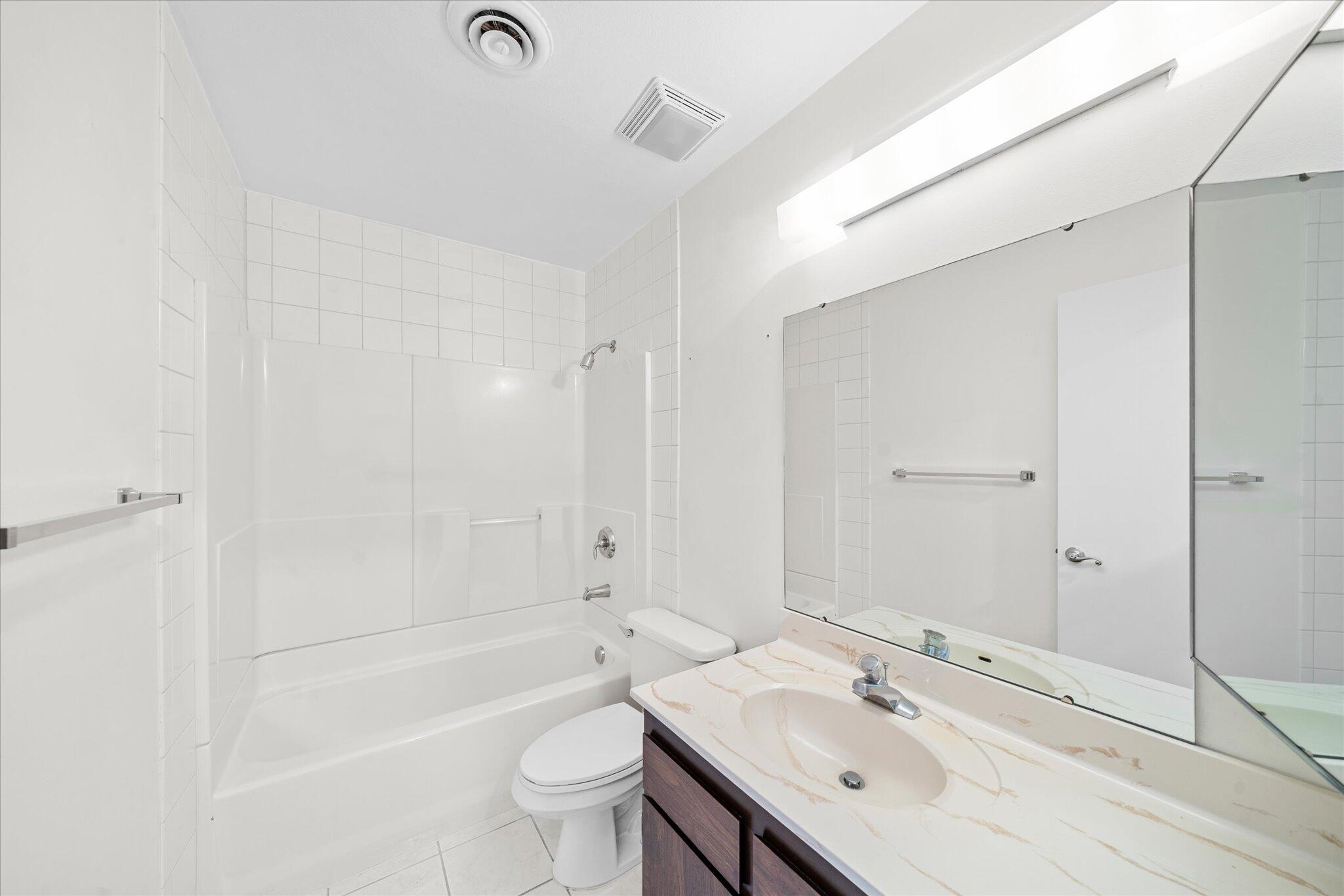 1954 Bechelli Lane Redding, CA 96002 - Photo 28 of 44 a bathroom with a bathtub shower sink mirror and toilet