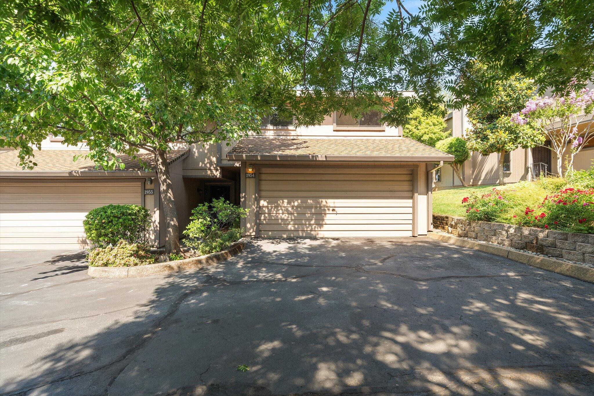1954 Bechelli Lane Redding, CA 96002 - Photo 35 of 44 a front view of a house with garden